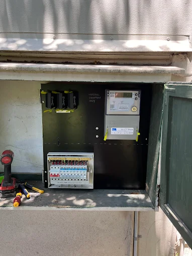 a licensed electrician performing electrical repairs at a Newcastle property