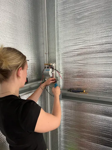 a licensed electrician working on a residential home electrical system