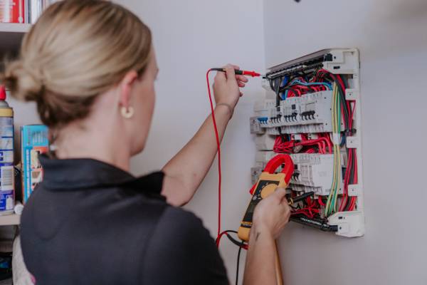 an electrician installing a power supply